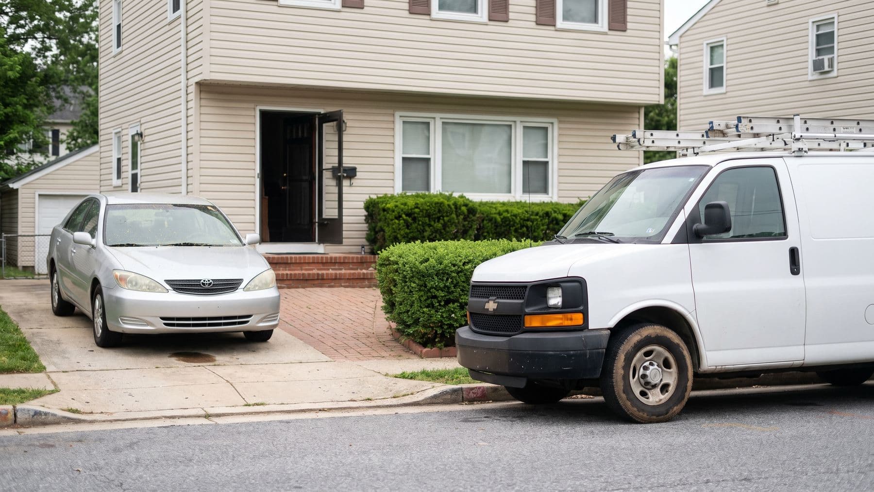 Illustration: a silver sedan in the driveway of a vinyl-sided colonial in suburban Baltimore, a white cargo van waiting at the curb.