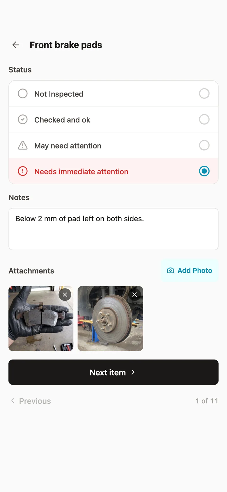 The Fixty iPhone app, an inspection item: Front brake pads marked Needs immediate attention, a note about 2 mm of pad left, and two photos of the worn pads and rotor